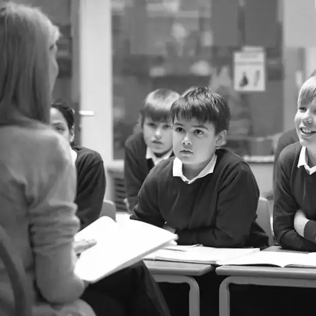 Students engaged in teaching strategies using FASST CABAS methodology in classroom.